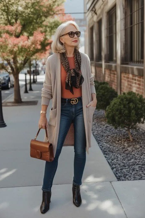 Beige cardigan with jeans and printed scarf on the street, layered fall outfit for mature women