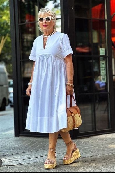 Light blue babydoll midi dress with short sleeves, casual summer look for mature women