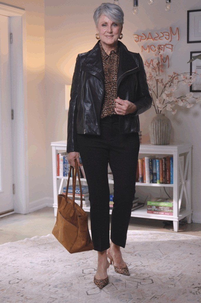 Black leather jacket with black top and pants, edgy fall outfit for women over 40