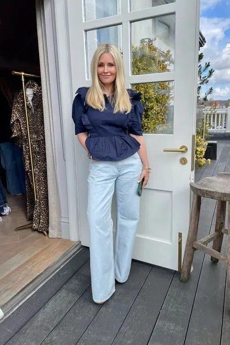 Navy Peplum Top with Light-Wash Jeans - fall jeans outfit for women over 40