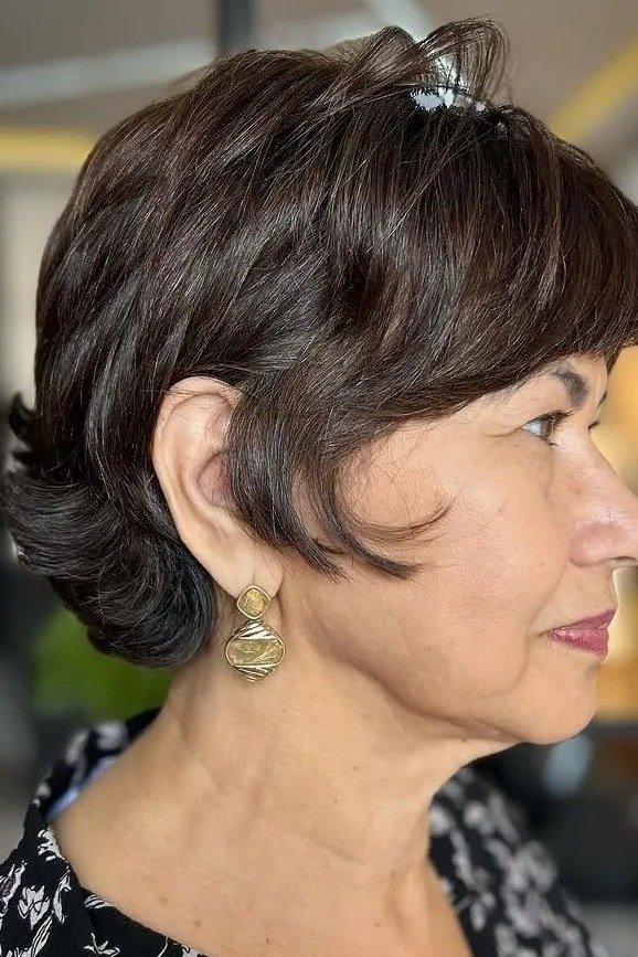 Brunette chin-length bob on a woman over 60, side view