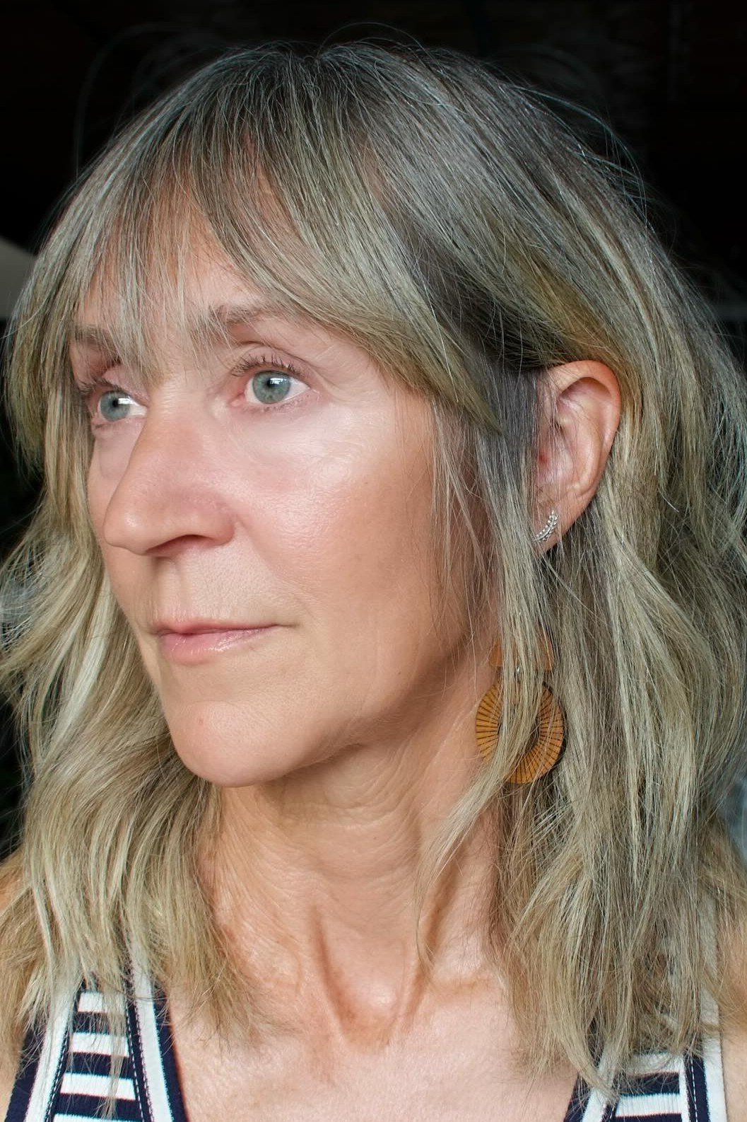 Silver wavy lob on a woman over 60, front view
