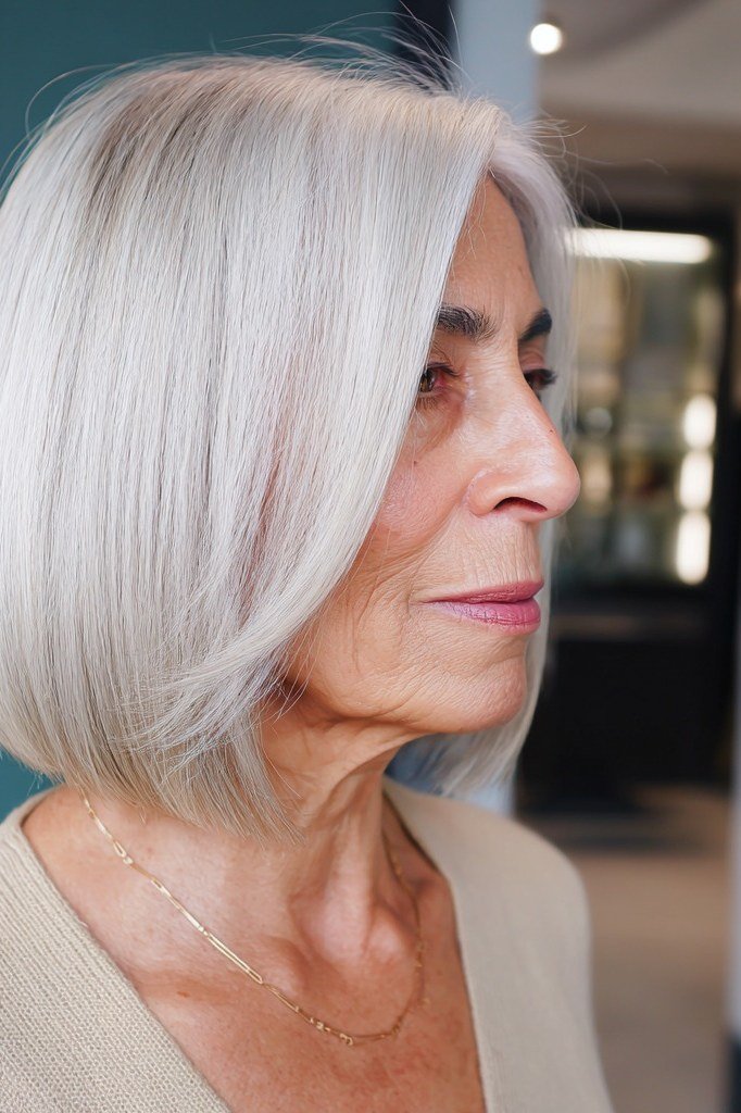 White bob on a woman over 60, side view