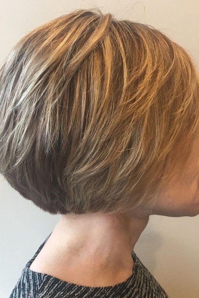 Copper stacked bob on a woman over 60, side view