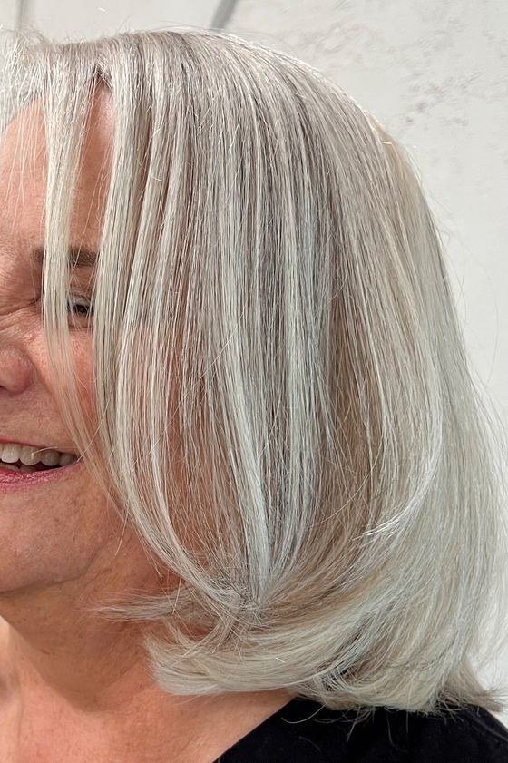 Silver straight lob on a woman over 60, side view