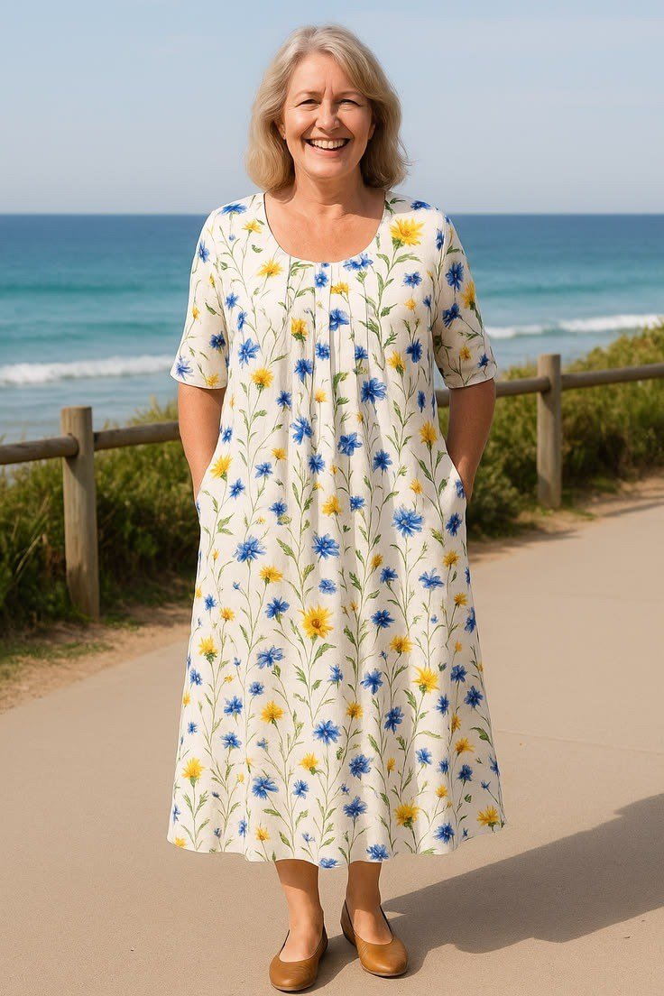 White midi dress with yellow and blue ditsy floral, beach boardwalk