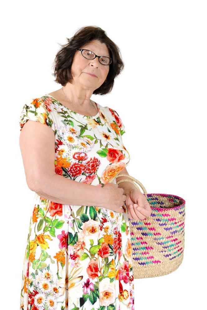 Multicolor floral tea dress on brunette woman with woven basket