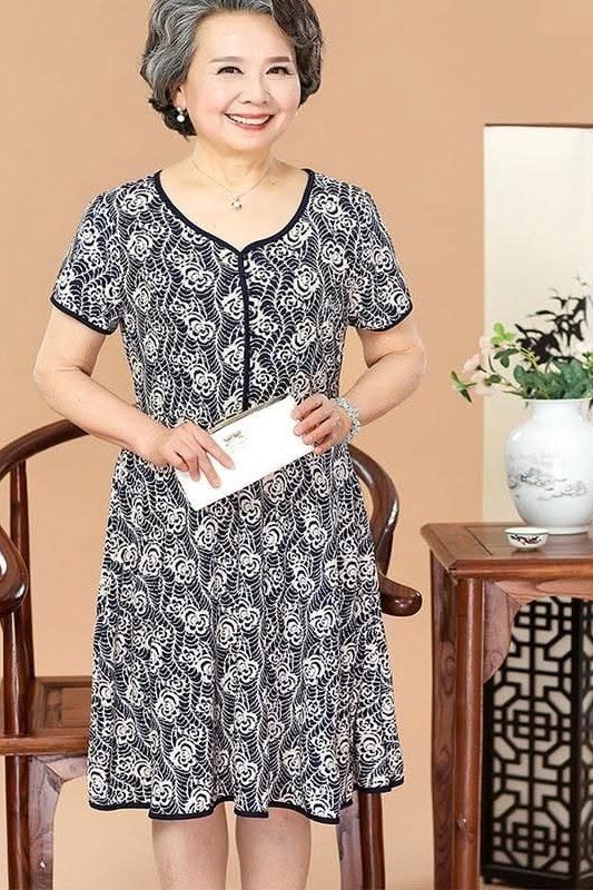 Black and white floral sheath dress on older Asian woman