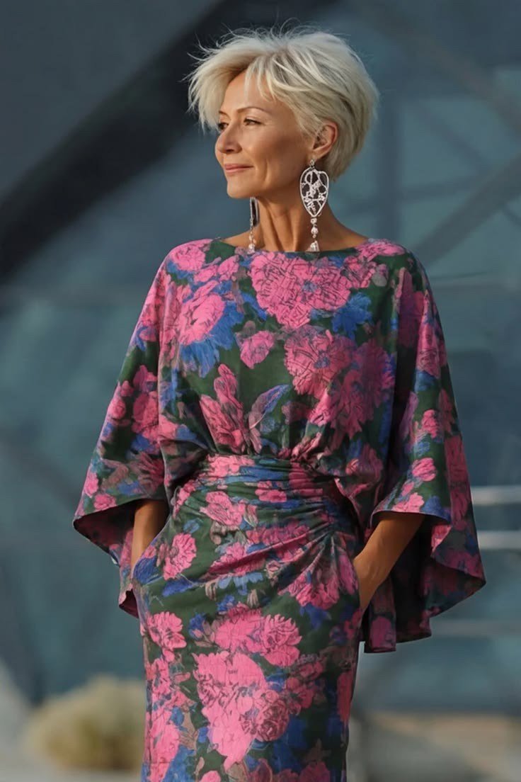 Magenta floral kimono-sleeve dress on elegant silver-haired woman