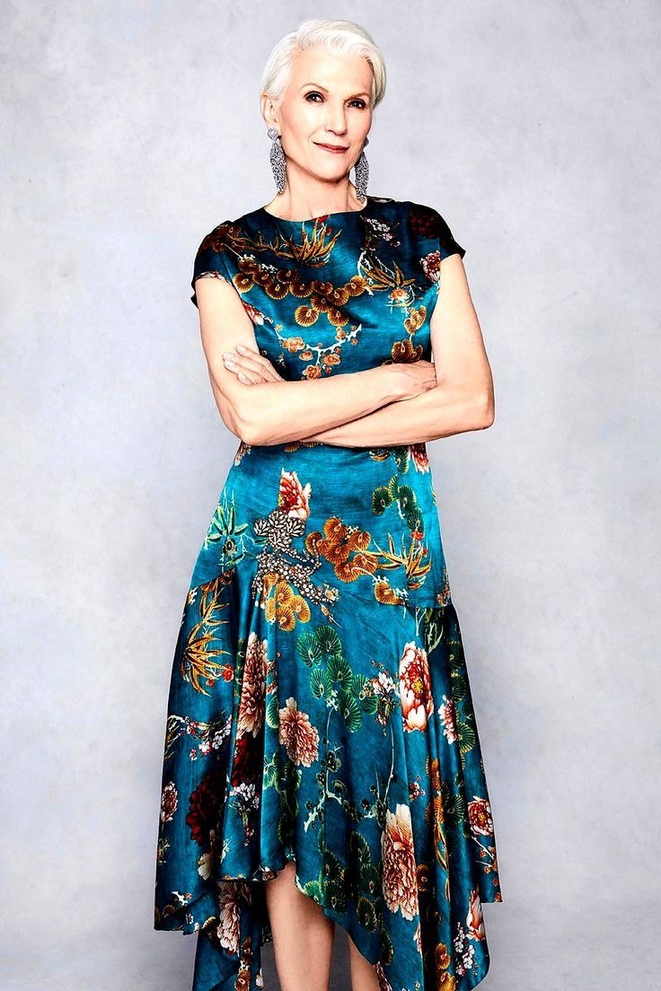 Teal maxi dress with orange and pink floral, white hair