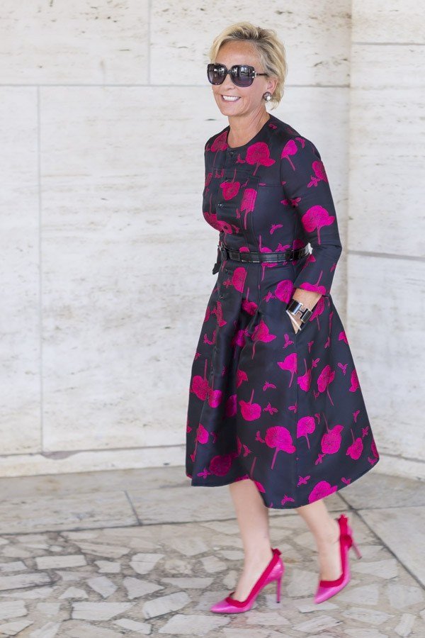 Black midi dress with pink floral, sunglasses and pink heels