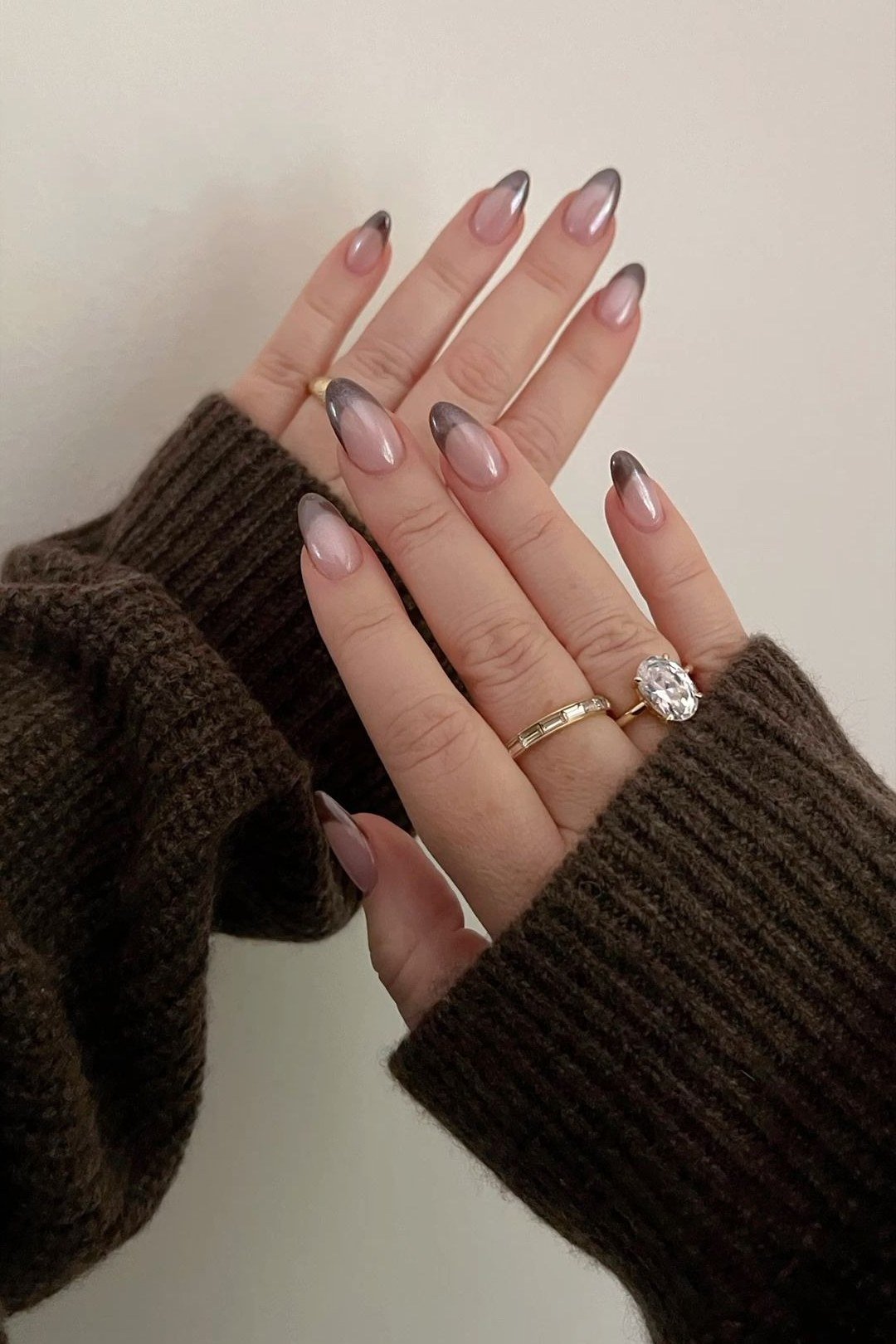 Cocoa brown chrome almond nails, hands in chocolate brown sweater