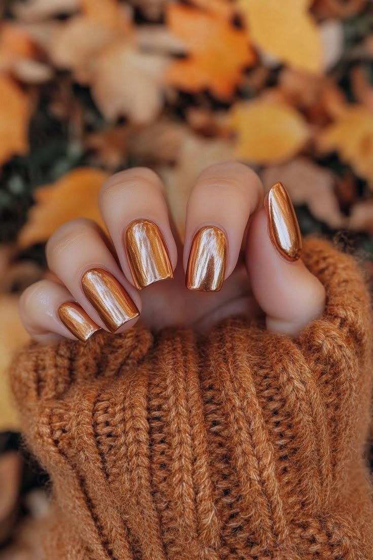 Copper chrome short nails with rust sweater and autumn leaves