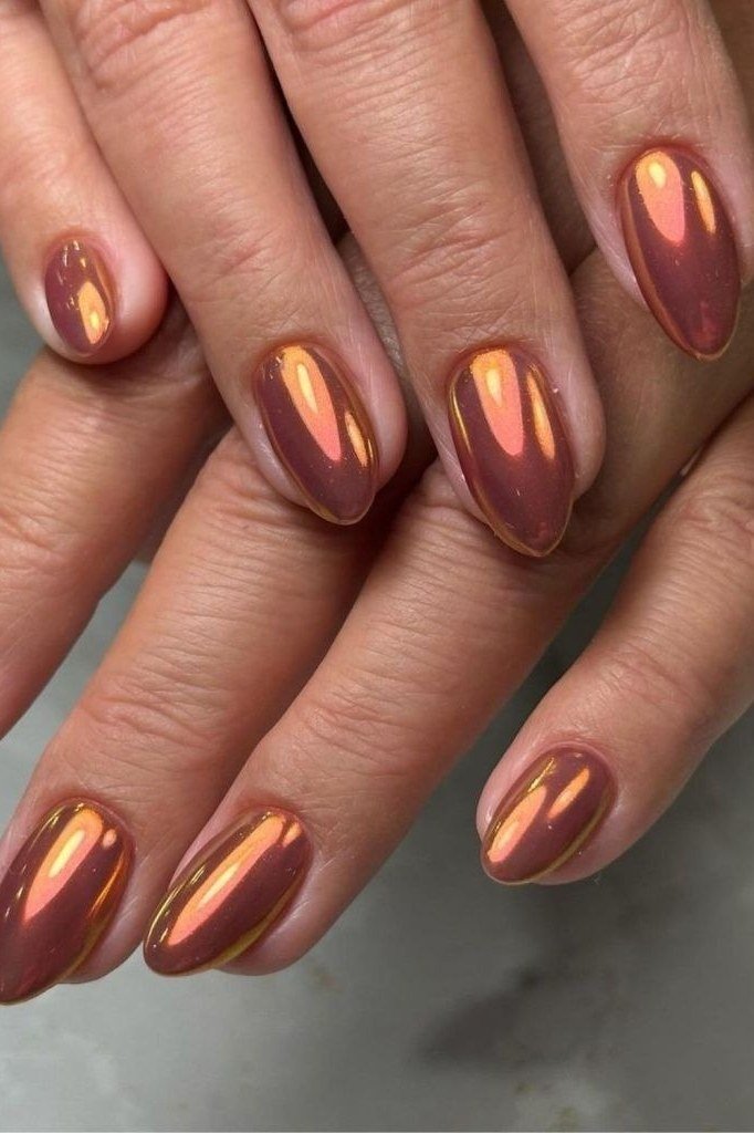 Rose gold chrome almond nails, romantic glowing manicure