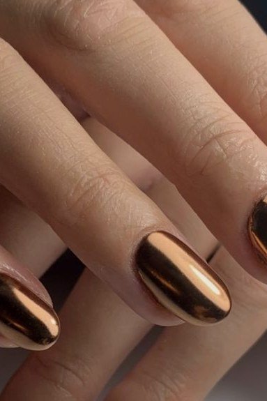 Classic copper chrome almond nails close-up