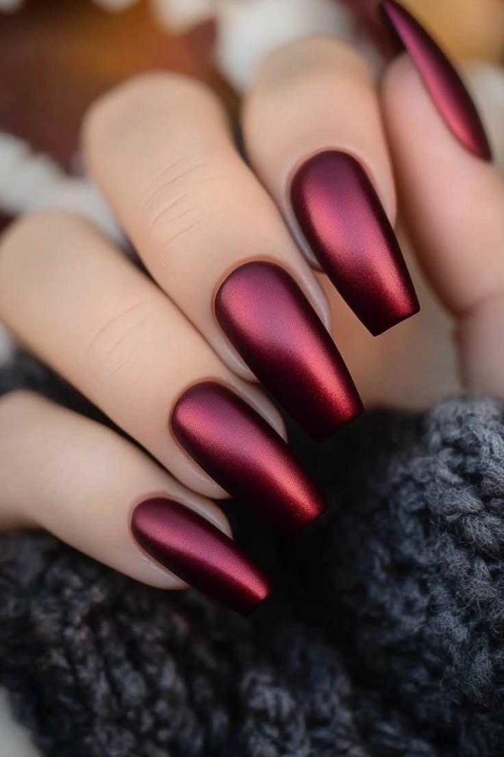 Wine cellar red chrome almond nails with dark knit