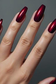 Coffin-length cherry chrome nails, deep red