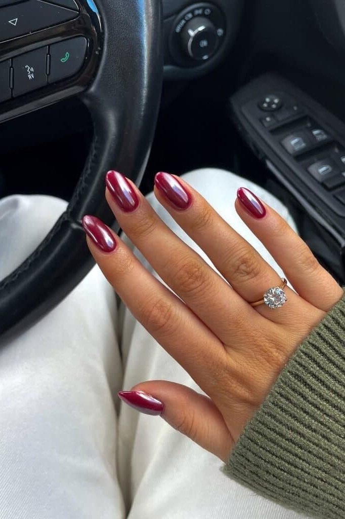Steering-wheel selfie red chrome almond nails with diamond ring