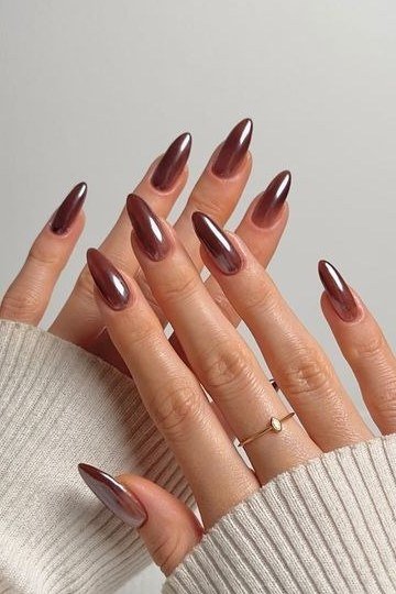 Cocoa cherry blend dark red brown chrome almond nails, white sweater
