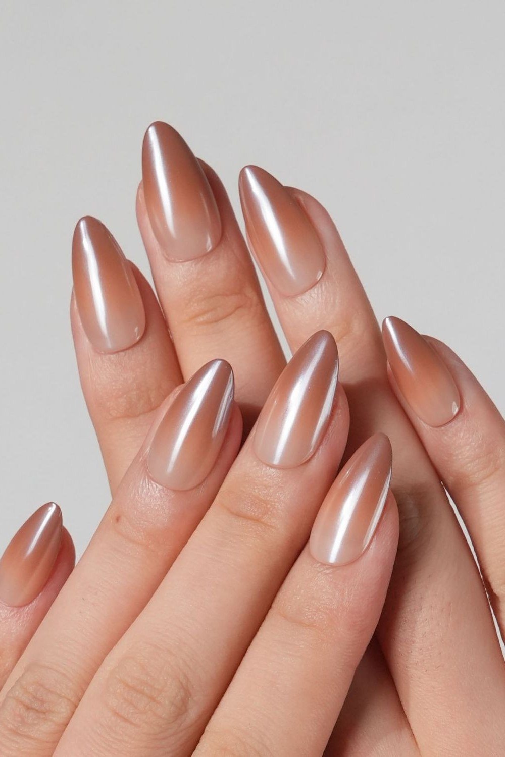 Blushing rose gold chrome almond nails