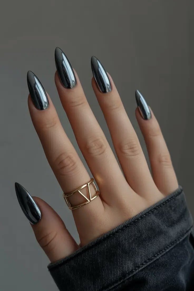 Gunmetal stiletto chrome nails with gold ring