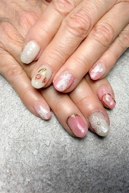 Pastel floral nail art on short nails for women over 50