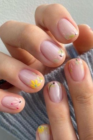 Pastel mini floral nail art on sheer nails for women over 50