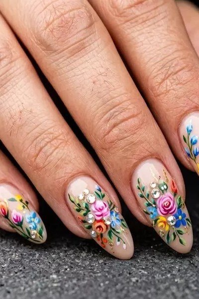 Colorful wildflower nail art on long almond nails for women over 50