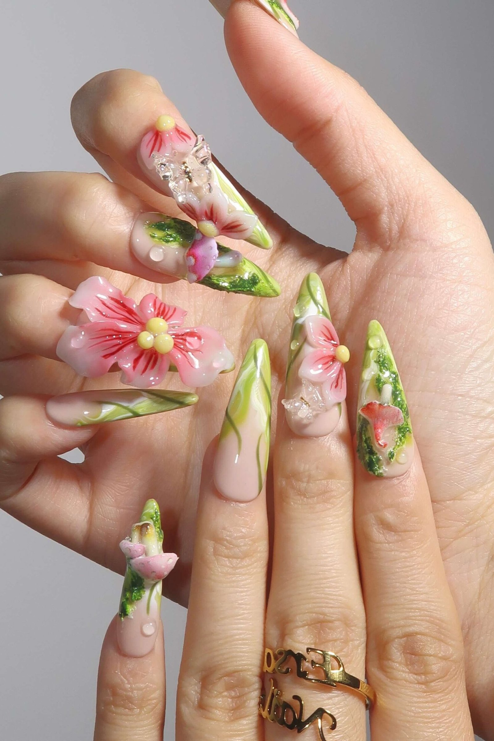 3D floral nail art on long stiletto nails for women over 50