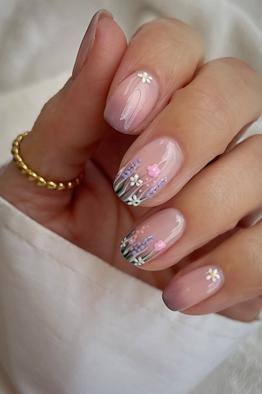 Pink floral nail art on grey nails for women over 50