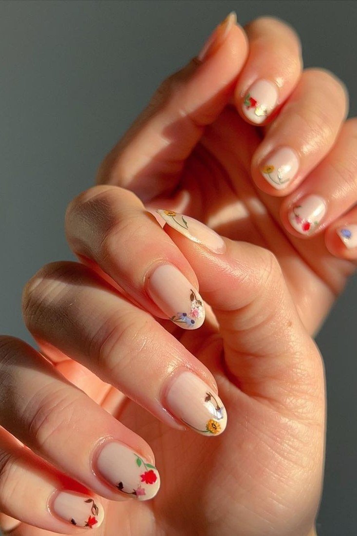 Warm coral mini floral nail art for women over 50