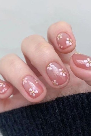 Pink cherry blossom nail art for women over 50