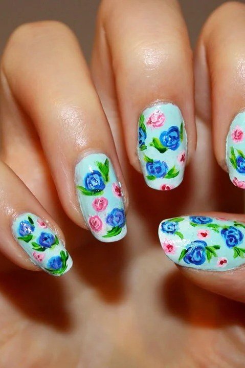 Confetti floral nail art on white nails for women over 50
