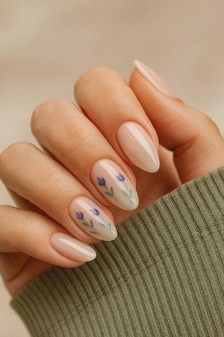 Subtle tiny floral nail art on nude nails for women over 50