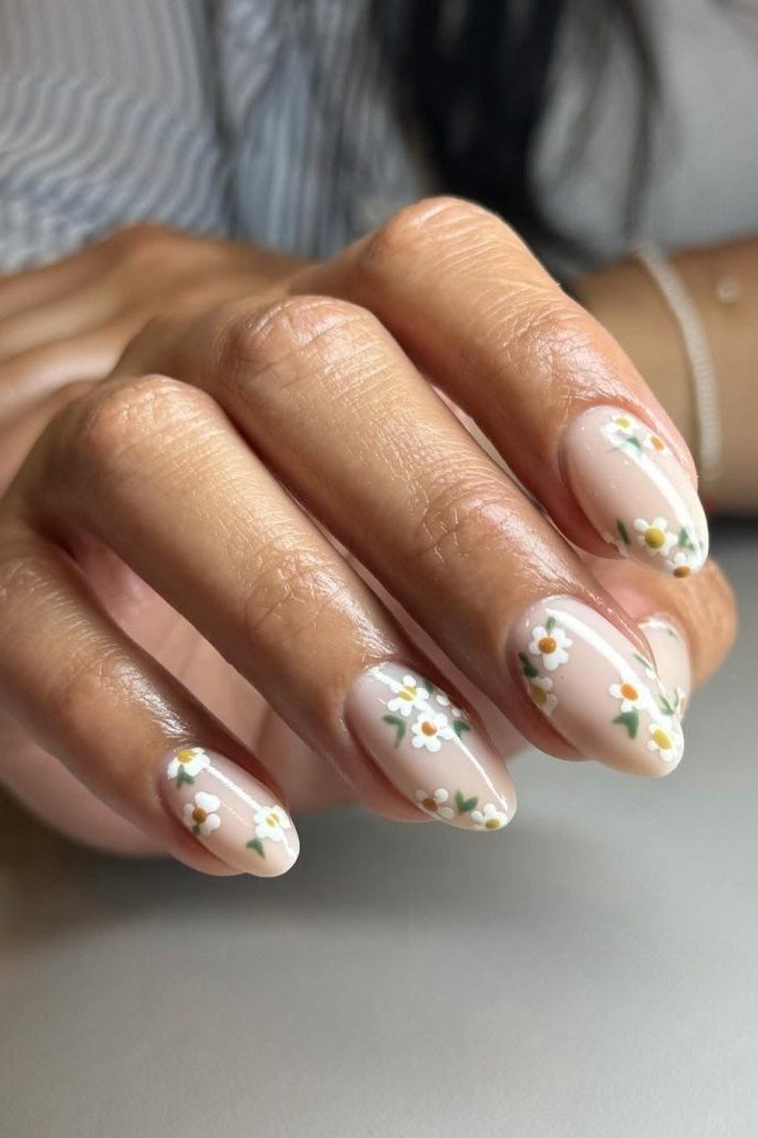 Subtle ghost floral nail art on deep nude nails for women over 50