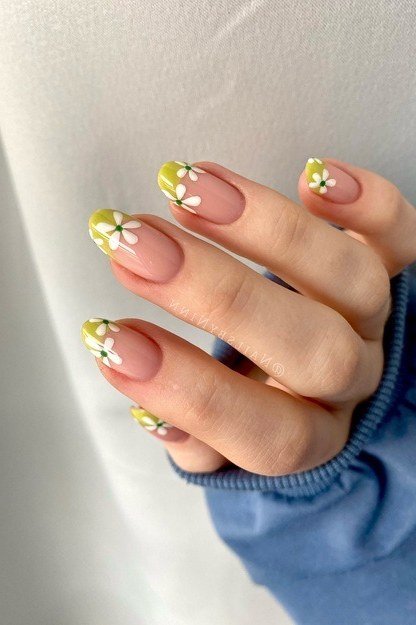 Yellow French tip nail art with daisies for women over 50