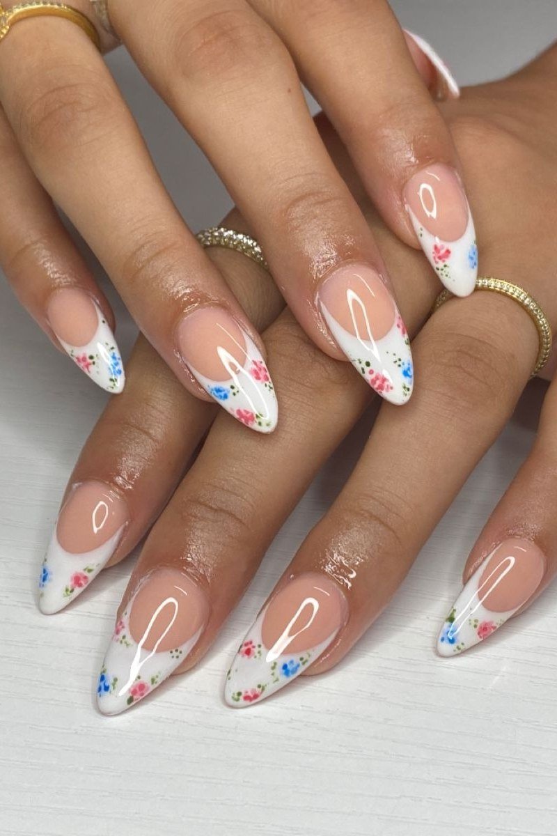 Floral French tip nail art on almond nails for women over 50