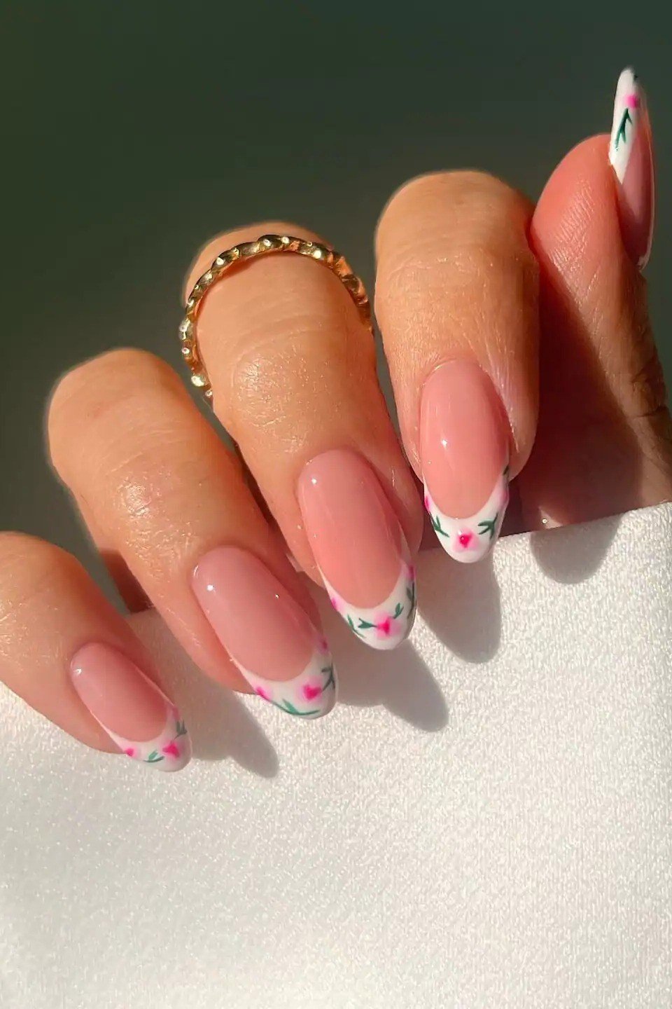 Pink floral French tip nail art for women over 50