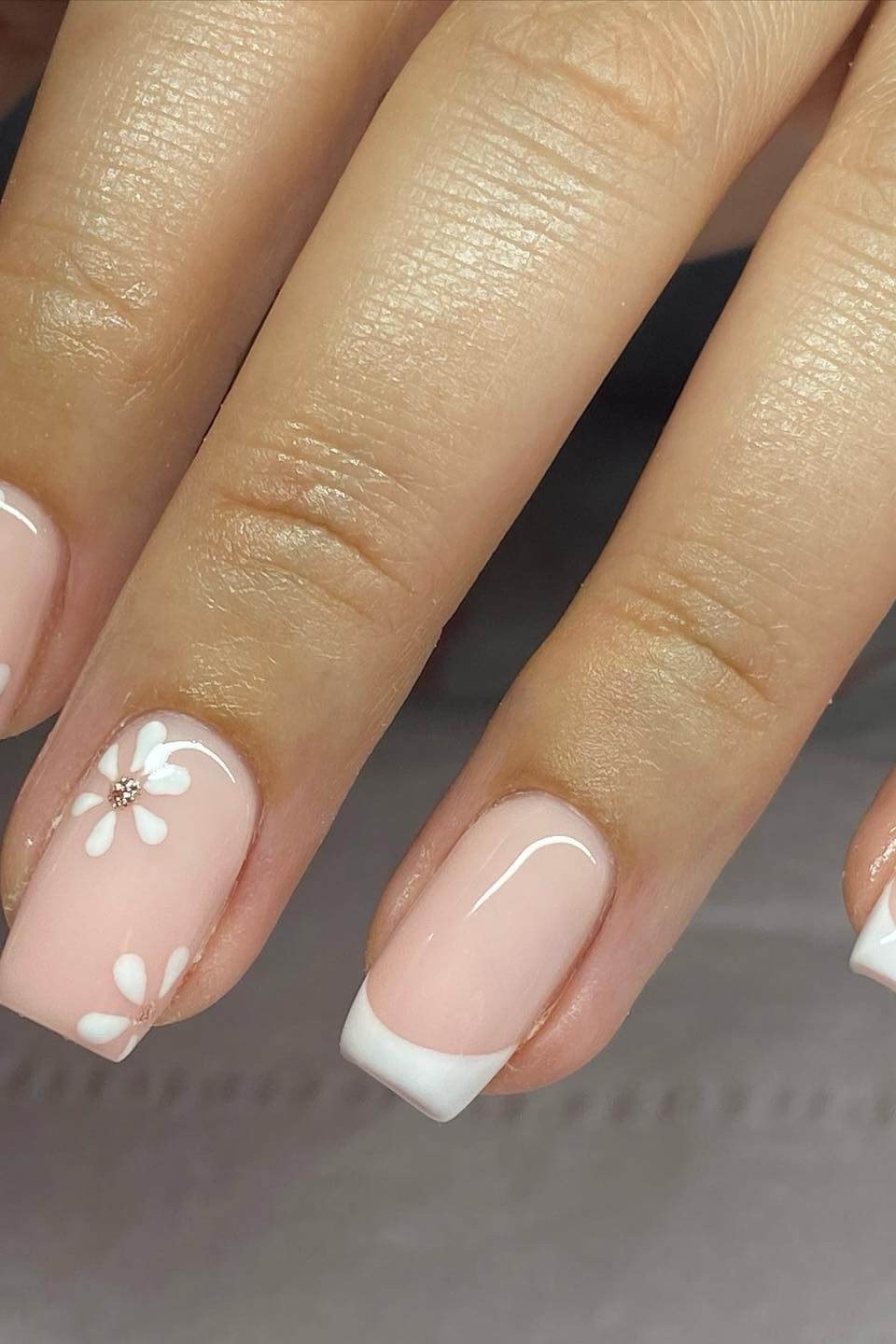 White floral French tip nail art for women over 50