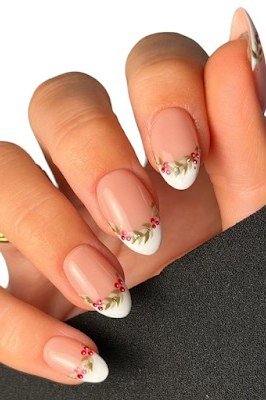 Floral French tip nail art on nude nails for women over 50