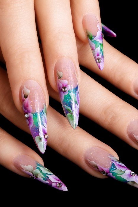 Bold purple floral nail art on stiletto nails for women over 50