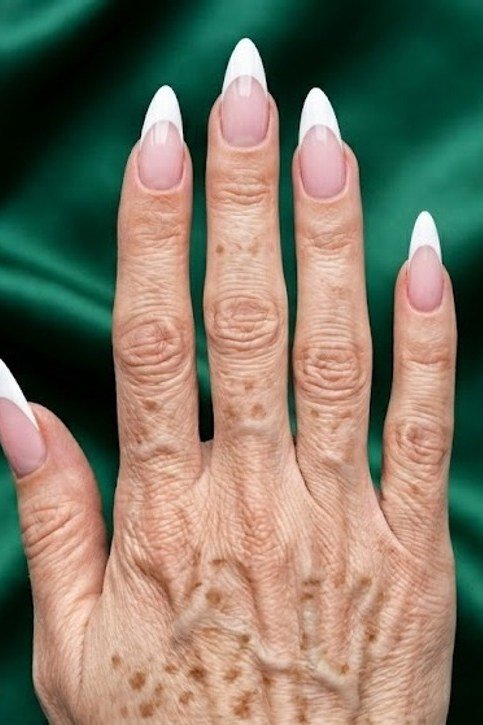 Dramatic Long White French Tips, french tip nails for women over 70, elegant manicure on mature hands