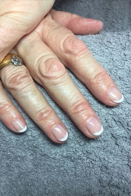 Everyday Almond French Tips, french tip nails for women over 70, elegant manicure on mature hands