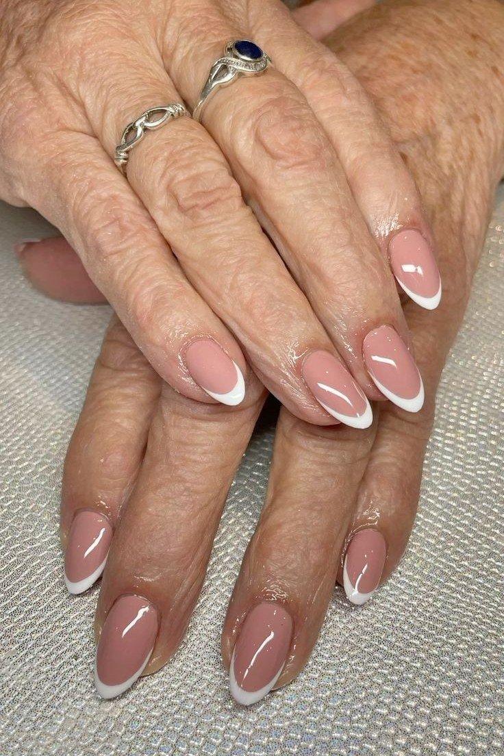 Almond French Tips with a Rosy Pink Base, french tip nails for women over 70, elegant manicure on mature hands