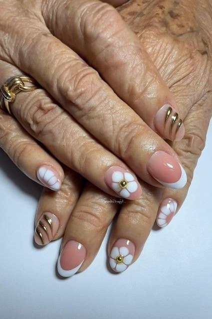 French Tips with Daisy Accents, french tip nails for women over 70, elegant manicure on mature hands