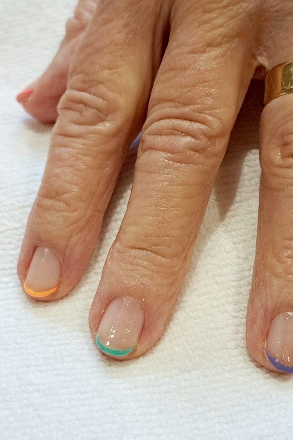 Multicolor Micro French Tips, french tip nails for women over 70, elegant manicure on mature hands