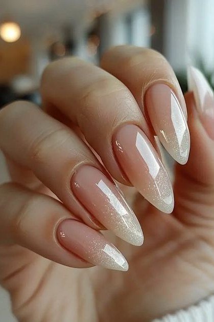 Long almond french manicure on a tan hand