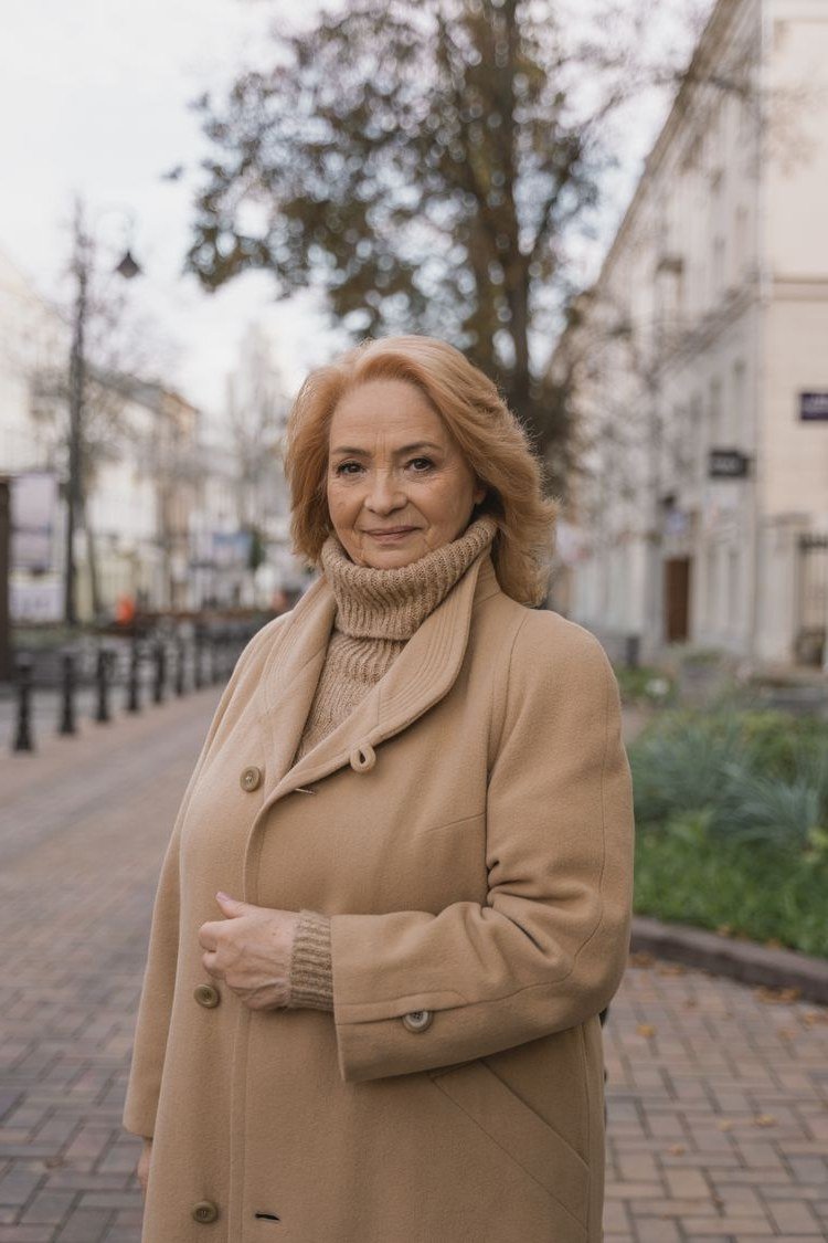 Fall sweater outfit idea 10 for women over 60: camel turtleneck with a camel coat