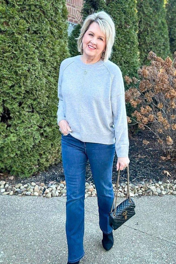 Fall sweater outfit idea 20 for women over 60: light blue sweater with blue jeans