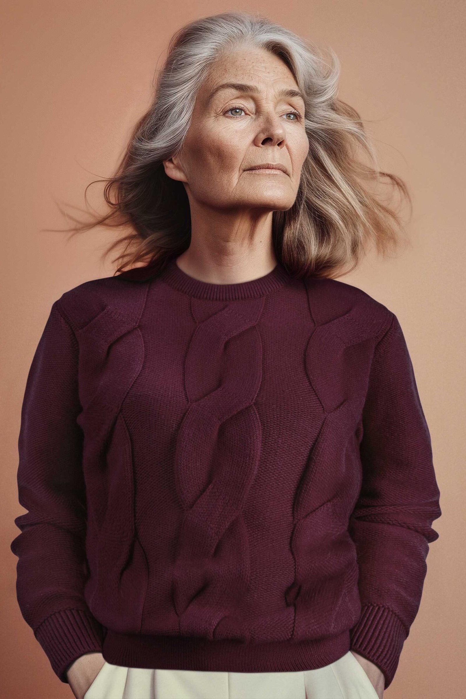 Fall sweater outfit idea 26 for women over 60: burgundy sweater with cream pants